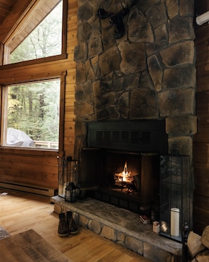 Wood burning fireplace overlooking the forest