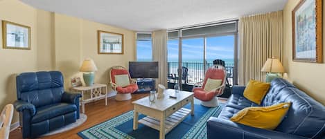 The ocean front living room is well-appointed with comfortable furnishings.