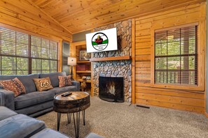 Living Area with Cable TV, Sofa Sleeper, and Seasonal Gas Fireplace