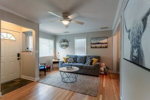Unwind in style at your vacation home, featuring modern, updated furniture and cozy touches for the perfect retreat.