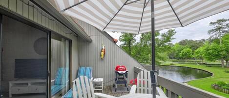 Deck with view of pond