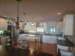 Large kitchen with lake views and Viking stove 