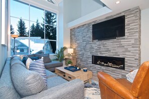 14 foot ceilings, all new furniture and stunning gas fireplace