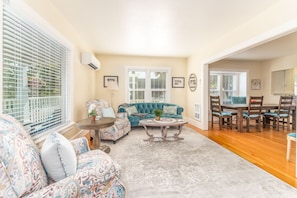 Living Room with French Country sofa and two reclining chairs.