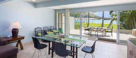 Dining room open up to the lanai, park and marina - bringing the Outside In