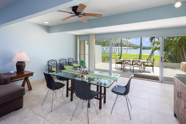 Dining room open up to the lanai, park and marina - bringing the Outside In