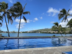 Take a swim after work and relax by the pool overlooking the marina