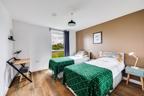 The bedroom has a comfortable zip and link bed set up as two single beds by default or can be zipped together to form a super-king size bed upon request. Fresh linen and towels provided.