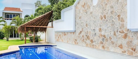 Large complex pool with palapa-shaded area to spend the day at the pool.