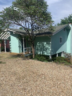 Plenty of extra parking on the gravel, as well as the pavement to garage.