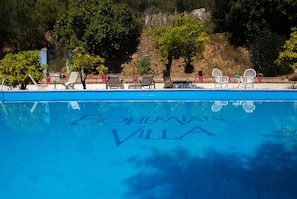 Pool with sun loungers at the Bohemian Villa Málaga holiday home