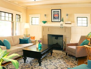 Warm living room with gas fireplace on the north wall