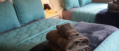 Comfy beds and fluffy towels in bedroom 3