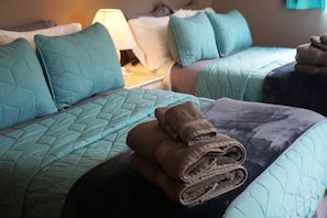 Comfy beds and fluffy towels in bedroom 3