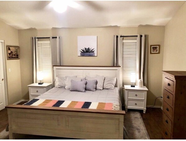 Spacious Master bedroom with king mattress, large walk in closet and 50” TV. 