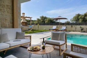 Lounge in the pergola-covered seating area.