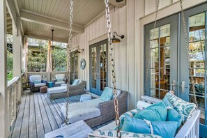 Decked out front porch with lots of comfy seating