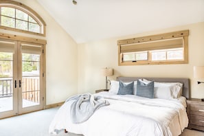 Master bedroom featuring en suite bathroom and designated balcony.