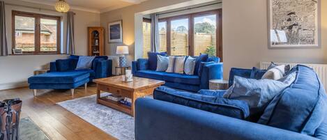 Monkey Puzzle Cottage, Snettisham: Sitting room with two sets of french doors to garden