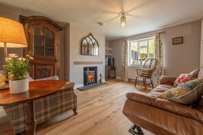 Pond Cottage, Edefield: Lovely sitting room with antique furniture, Smart television and wood burning stove