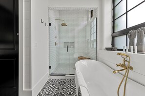 The oversized walk-in shower provides a luxury spa experience every day of your stay here.