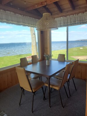 Sunroom by daylight. Take 10 steps out the door & walk down our steps into lake!