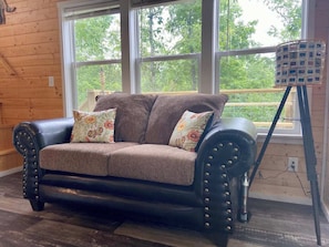 The living features plenty of natural light and a very comfy couch!