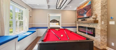 Fully equipped  Game room  with Pool table, Ping Pong, Wireless hook ups for Gaming, 60 inch TV, lineal fireplace and more...