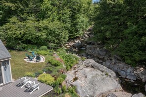 Aerial view of deck and firepit by the brook