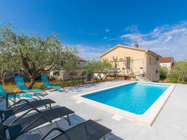 Sky, Plant, Furniture, Property, Cloud, Building, Water, Swimming Pool, Chair, Azure