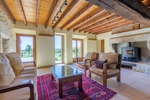 The sitting room with views over the garden and valley