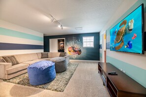 Loft with seating and large tv