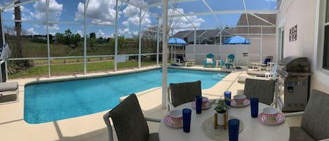 Beautiful pool deck with covered lanai, sun shades,BBQ, ample seating & loungers