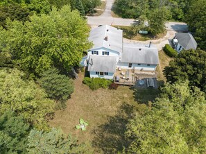 View of the property and expansive yard