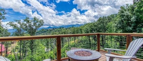 Sunrise Chalet's crackling deck firepit with views