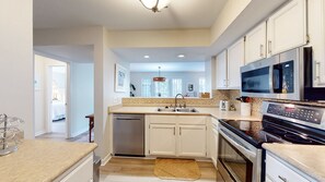 Fully Stocked Kitchen with Pass-Through Window