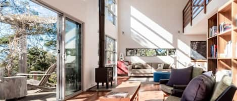 Open living space, drenched in sunlight and  linking to the outdoor decking area