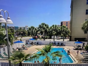 Heated large pool with plenty of pool chairs