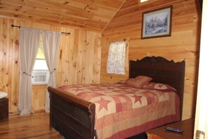 pare bedroom with a dresser. 