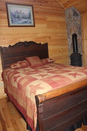 Spare bedroom showing where the original cookstove was located. Now a decoration