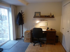 Desk has office supplies and tourist brochures of the area.