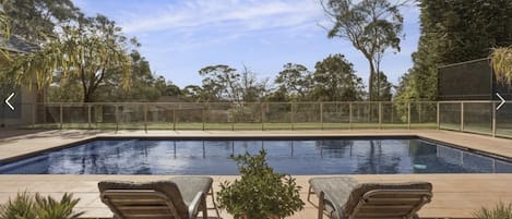 Solar-heated in-ground pool, fully tiled with large wide step in shallow end