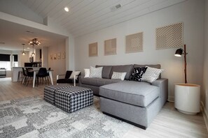 Relax in the sun-filled living room on the plush chaise lounge in front of the cozy gas fireplace