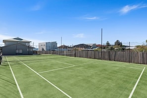Outdoor tennis court (rackets and tennis balls provided)