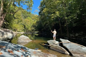 Fish right in the backyard! Rainbow trout and bass are in the quiet pools of the river.