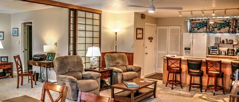 Spacious living area with Lazy Boy Recliners looking toward kitchen