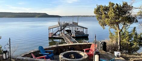 Enjoy a wood burning fire pit down by the lake. 