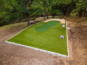 Incredible private golf hole with 40-yard and 70-yard tee boxes, plus multi-sport area with corn hole, bocce ball, and dice games