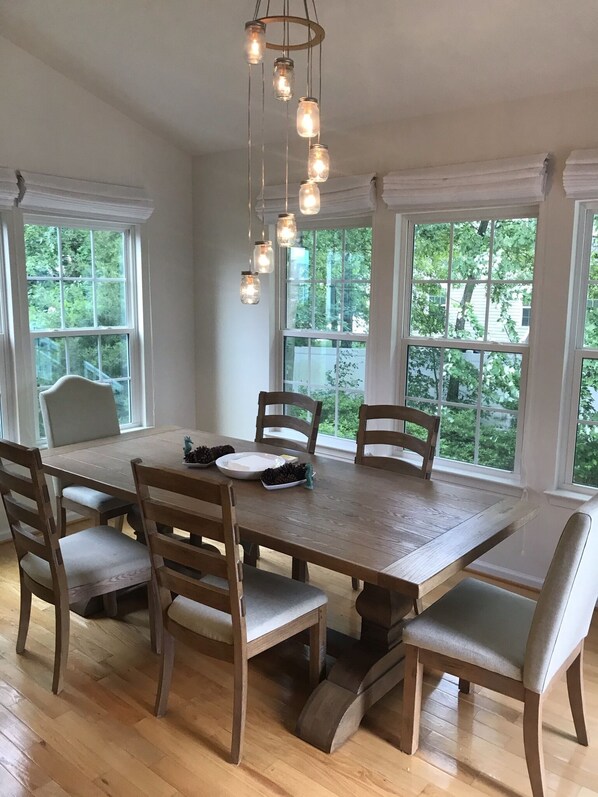 South-facing Dining Room in open floor plan to kitchen and living room.