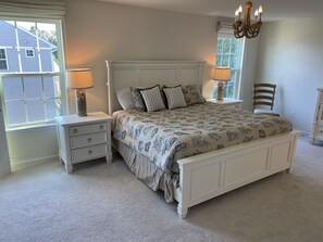 Enormous master bedroom with king size bed and walk-in closet.